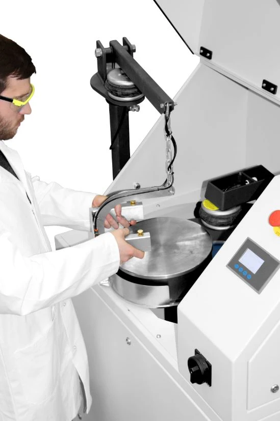 Scientist operating the RS 300 vibratory disc mill